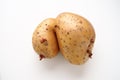 Ugly potatoes on white background. Unnormal vegetable, zero waste. Irregular shaped pratie spud. Influence of dioxins