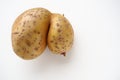 Ugly potatoes on white background. Unnormal vegetable, zero waste. Irregular shaped pratie spud. Influence of dioxins Royalty Free Stock Photo