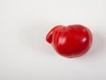 Ugly tomato on a white background. Horizontally. Ugly vegetables. Deformed vegetables. Copy spaes