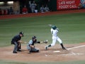 UH Batter swings at incoming pitch with catcher and umpire behind him Royalty Free Stock Photo