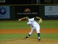 UH Pitcher steps forward to throws side arm from the mound