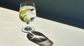 Uhd Image Of A Lime Shadow On A White Countertop With A Mug Of Water