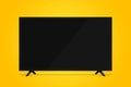 uhd smart tv on yellow background Royalty Free Stock Photo