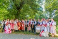 Folk Music Group in Traditional Dress Preparing for Performance