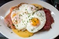 Uitsmijter, traditional dutch breakfast with fry egg with salmon, roast beef, cheese and sliced of bread. Royalty Free Stock Photo