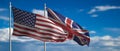 UK and America waving flags on blue sky. 3d illustration