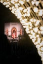 UK, Belfast - Dec 2012: Father Christmas outside a brightly lit festive house with blurred decorative lights