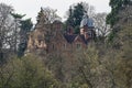 Large Victorian manor house screened by trees