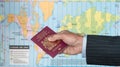 UK Citizen with passport and world map of timezones Royalty Free Stock Photo
