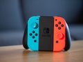 UK - Feb 2020: Nintendo switch blue and red neon joy con grip pad controller Royalty Free Stock Photo