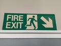 UK green and white fire exit sign Royalty Free Stock Photo