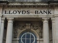 Impressive architecture of a fomer Lloyds Bank with golden lettering on exterior