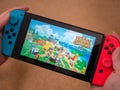 UK, March 2020: Nintendo Switch games console hand held animal crossing new horizons