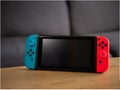 UK, March 2020: Nintendo switch handheld console in home setting