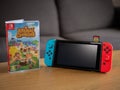 UK, March 2020: Nintendo switch handheld game console with Animal Crossing game