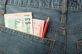 UK money and lottery bet slip in pocket