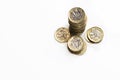 UK money, stack of pound coins economic growth shown by cash in piles