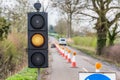 UK Motorway Roadworks Yellow Traffic Lights Cones Royalty Free Stock Photo