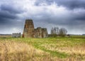 St Benet`s Abbey gatehouse and mill on the Norfolk Broads during a winter storm Royalty Free Stock Photo