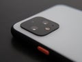 UK, October 2019: Pixel 4 white smart phone macro camera lens and power button