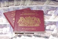 UK Passports on money background