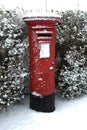 UK Red Postbox in the snow Royalty Free Stock Photo