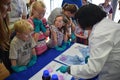 Laboratory chemists take a day out of the lab to teach children about chemistry as part of the UK STEM, science, technology,engine Royalty Free Stock Photo