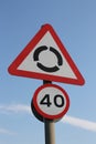 UK roundabout ahead and 40mph reminder signs