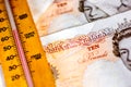 UK ten pound notes and thermometer Royalty Free Stock Photo