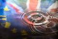 UK Union Jack and European Union EU flags reflected in water splash with a drop of water falling Royalty Free Stock Photo