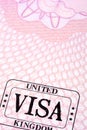 UK visa document immigration stamp passport page close up, copy space, vertical