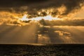 UK Weather:Sunrays over the distant Walney Offshore Windfarm.