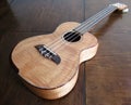 Ukelele Hawaiian Instrument on Wood Table Royalty Free Stock Photo
