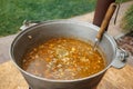 The ukha is being cooked in a large cauldron. Royalty Free Stock Photo