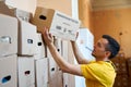 Ukrainan volunteer sorting boxes with humanitarian aid to Ukraine from UK Royalty Free Stock Photo
