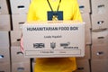 Ukrainan volunteer sorting boxes with humanitarian aid to Ukraine from UK Royalty Free Stock Photo