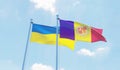 Ukraine and Andorra, two flags waving against blue sky Royalty Free Stock Photo