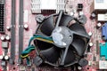 Ukraine - April 25, 2020: Close-up of PCU cooler connected to the motherboard of computer. Top view, background idea concept.