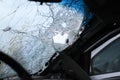 Ukraine, Bucha - 04.21.2022: Broken car windshield, bullet holes and old blood spatter.