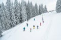 Ukraine, Bukovel - December 15, 2018. Mountain ski spot. Lots of snowboarders and skiers ride from snow hill. Winter Carpathians