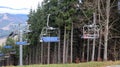 Ukraine, Bukovel - November 20, 2019. Autumn view of the ski resort with a chairlift against the background of autumn mountain