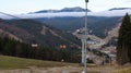 Ukraine, Bukovel - November 20, 2019. Autumn view of the ski resort with a chairlift against the background of autumn mountain