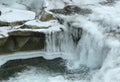 Ukraine, Carpathians, frozen alpine river with waterfall Royalty Free Stock Photo