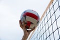 Ukraine, Chernigov July 28, 2020: Beach volleyball master class. Beautiful girl plays volleyball, hand with a ball close-up