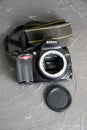 Ukraine, Chernihiv, February 21, 2023 : old used photo equipment, old camera with scratches on a gray background