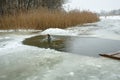 Ukraine, the city of Romny, January 19, 2013: the feast of the Baptism of the Lord. The Orthodox rite of bathing in a pit.