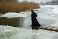 Ukraine, the city of Romny, January 19, 2013: the feast of the Baptism of the Lord. The Orthodox rite of bathing in a pit.