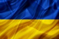 Ukraine country flag on silk or silky waving texture Royalty Free Stock Photo