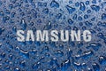 UKRAINE, DNEPR - AUGUST 25, 2022: Samsung company logo. Water drops on Samsung logo Royalty Free Stock Photo