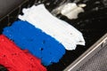 Ukraine Dnepr 04.03.2022 - Broken apple iPhone 4 with a painted Russian flag, sanctions in Russia, Russia`s war against Ukraine,